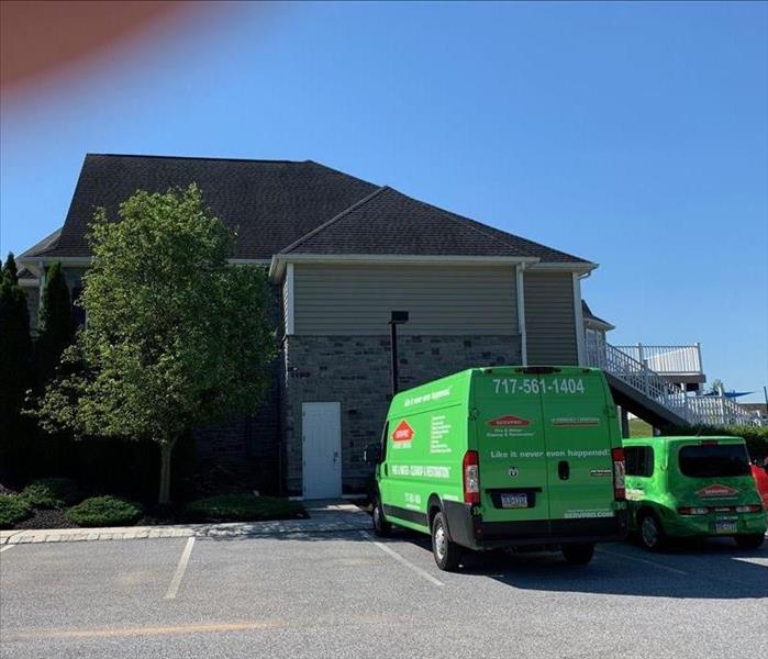 TOA clubhouse with SERVPRO vehicle in driveway